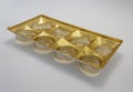 Gold plastic packaging for chocolates close up