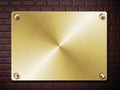 Gold plate on brick wall Royalty Free Stock Photo