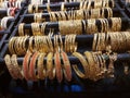 Gold plated Bangles are displayed with white sakha and red nowa.