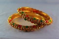 Gold plated colored bangles Royalty Free Stock Photo