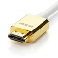 Gold-plated hdmi cable connector attached to a white cable Royalty Free Stock Photo
