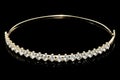 a gold plated headband with white diamonds