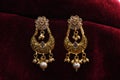 Gold plated jewelry -Fancy Designer golden earrings macro image