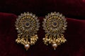 Gold plated jewelry -Fancy Designer golden earrings macro image