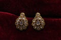 Gold plated jewelry -Fancy Designer golden earrings macro image