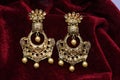 Gold plated jewelry -Fancy Designer golden long earrings macro image