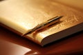 Gold-plated pen resting on leather-bound journal. Generative AI Royalty Free Stock Photo