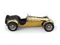 Gold plated vintage sport open wheel racing car - side view Royalty Free Stock Photo