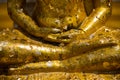 Gold plates on buddha,The Buddha statue to gild with gold leaf. Royalty Free Stock Photo
