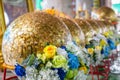 Gold plates on the surface of the Luuk Nimit,Luk Nimit,golden sphere stone,stick gold leaf sheet of the thai temple,Thailand Royalty Free Stock Photo