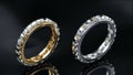 Gold and platinum diamond rings with diamonds surrounding the ring. Ring design on black glass surface with 3D Royalty Free Stock Photo