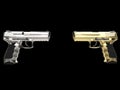 Gold and platinum modern semi auto guns pointing at each other