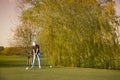 Gold player teeing-off. Royalty Free Stock Photo