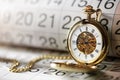 Gold pocket watch and calendar Royalty Free Stock Photo