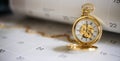 Gold pocket watch and calendar Royalty Free Stock Photo