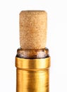 Gold premium wine bottle cork macro, closeup Cork sitting tight, closed golden bottle neck wrapping, side view, top part up close