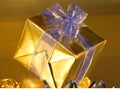 Gold present with blue ribbons Royalty Free Stock Photo