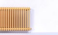 Gold radiator and white wall Royalty Free Stock Photo