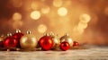 Gold and red baubles and gold fir branch Christmas tree ornaments on with beautiful light bokeh background, Christmas background Royalty Free Stock Photo