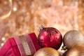 Gold and red christmas baubles and red box Royalty Free Stock Photo