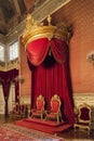 Gold and Red King and Queen thrones under a baldachin in the Throne Room