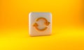Gold Refresh icon isolated on yellow background. Reload symbol. Rotation arrows in a circle sign. Silver square button