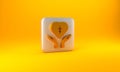Gold Religious cross in the heart inside icon isolated on yellow background. Love of God, Catholic and Christian symbol