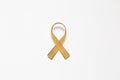 Gold ribbon as symbol of childhood cancer awareness isolated on Royalty Free Stock Photo