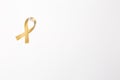 Gold ribbon as symbol of childhood cancer awareness isolated on Royalty Free Stock Photo