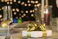 Gold ribbon gift on table Royalty Free Stock Photo