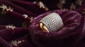 Gold ring adorned with diamond resting on a velvet Royalty Free Stock Photo