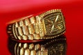 Gold ring with brilliant on background Royalty Free Stock Photo