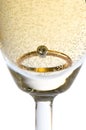 Gold ring in champagne Royalty Free Stock Photo