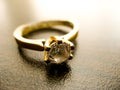 Gold ring  diamond gem closeup. Gold wedding or engagement  ring decorated with diamond Royalty Free Stock Photo