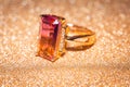 Gold ring with pink yellow stone Royalty Free Stock Photo