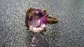 Gold ring with purple stone