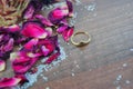 Gold ring, rose petals, rose