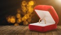 Gold ring, wedding ring in red box. The moment of a wedding, anniversary, engagement, or Valentine's Day. Happy day. Royalty Free Stock Photo