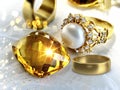 Gold ring  yellow citrine natural white pearl and gold rings on white background women luxury  jewelry acessory copy space Royalty Free Stock Photo