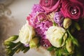 gold rings and a beautiful bridal bouquet of roses on the background. details  wedding traditions. close-up  macro Royalty Free Stock Photo