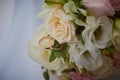 gold rings and a beautiful bridal bouquet of roses on the background. details  wedding traditions. close-up  macro Royalty Free Stock Photo