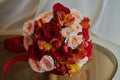 gold rings and a beautiful bridal bouquet of roses on the background. details  wedding traditions. close-up  macro Royalty Free Stock Photo