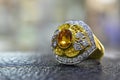 Gold rings decorated with yellow gemstones and genuine diamonds Royalty Free Stock Photo