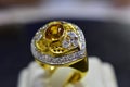 Gold rings decorated with yellow gemstones and genuine diamonds Royalty Free Stock Photo