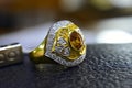 Gold rings decorated with yellow gemstones and genuine diamonds Royalty Free Stock Photo