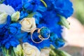 Gold rings and a festive wedding bouquet