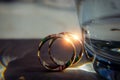 Gold rings of the newlyweds shine and reflect the light, close-up, blurred background. Abstract photo, wedding accessories