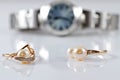 Gold rings with pearls of different styles on the background watches Royalty Free Stock Photo