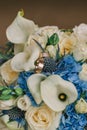 Gold rings on wedding flowers with selective focus Royalty Free Stock Photo