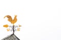 Gold rooster weather vane show the wind direction on white sky Royalty Free Stock Photo